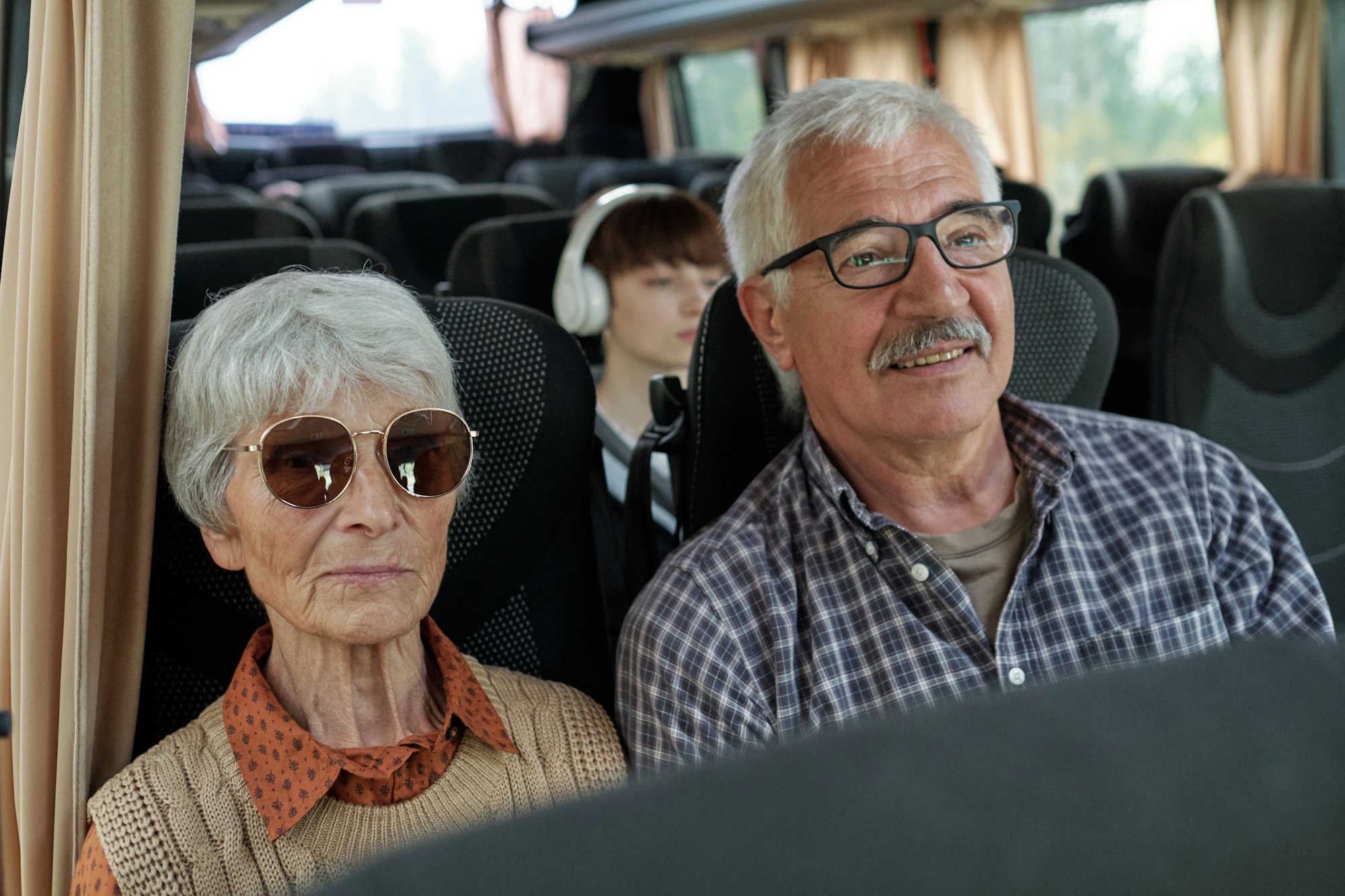 Senior Couple Travelling By Bus